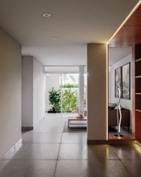 &Aacute;rea de estar con biblioteca integrada de madera y escalera de porcelanato con iluminaci&oacute;n LED.